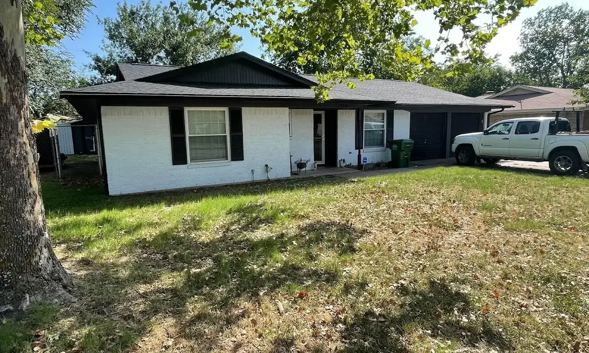 Professional roofing crew working on a residential roof in North Sewickley